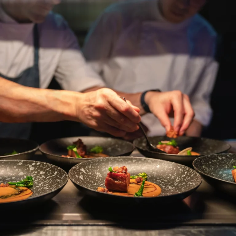 Chef plating refined Italian dishes